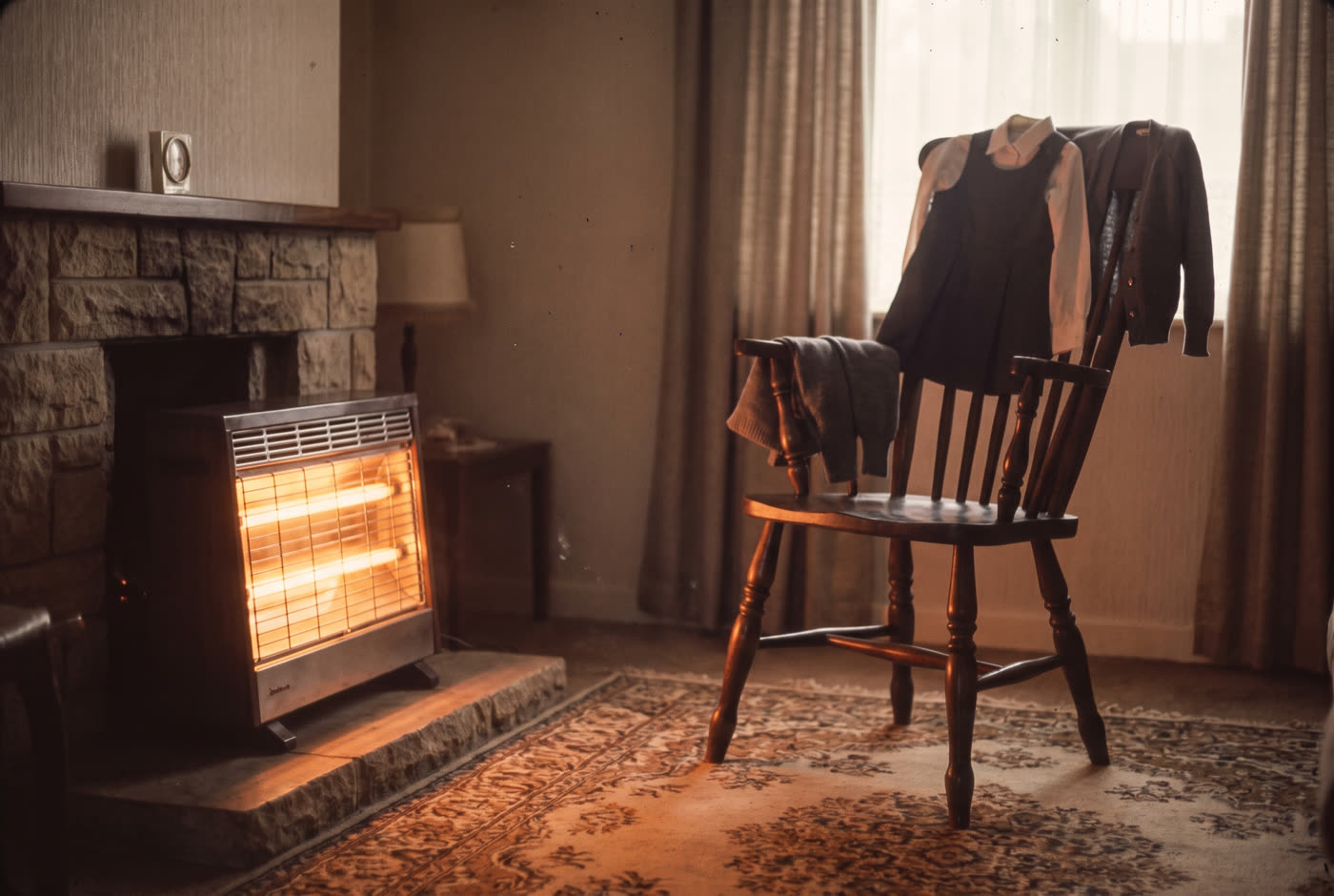 Getting dressed in front of a two-bar electric fire