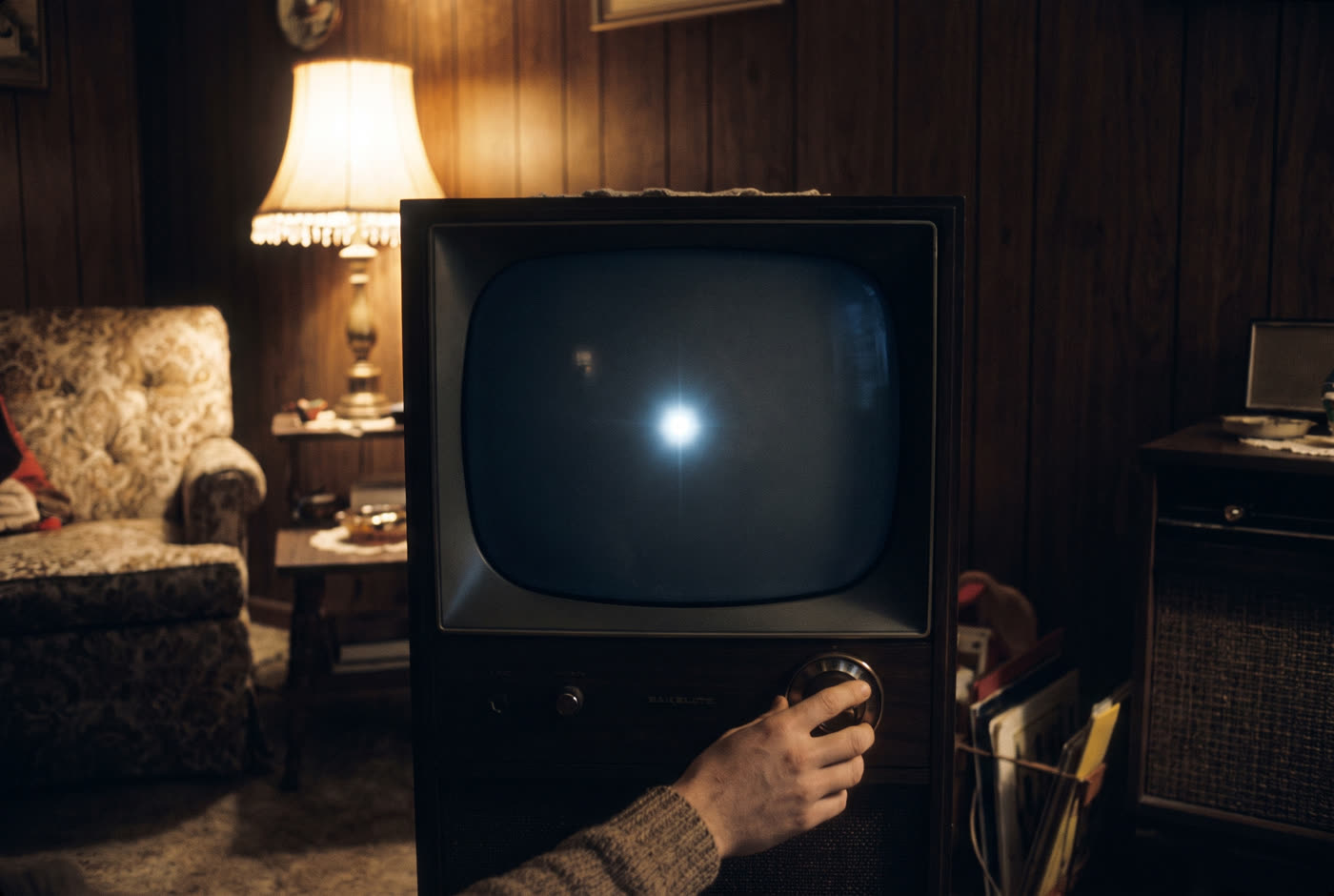 The very specific sound of the TV being turned off at night